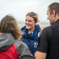 A photo of a Wildlife Warden talking to people about wildlife