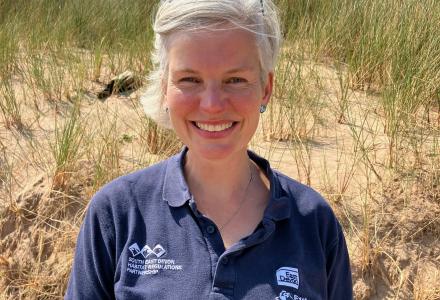 A photo of Katie Jones, Wildlife Warden, at Dawlish Warren